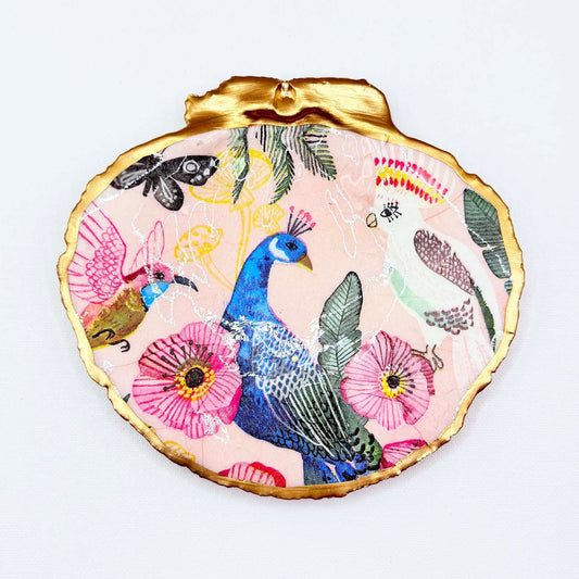 Decorative plate with peacock and floral design on a white background