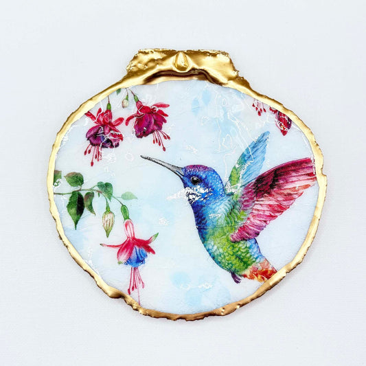 Decorative plate with a colorful hummingbird and fuchsia flowers design on a white background
