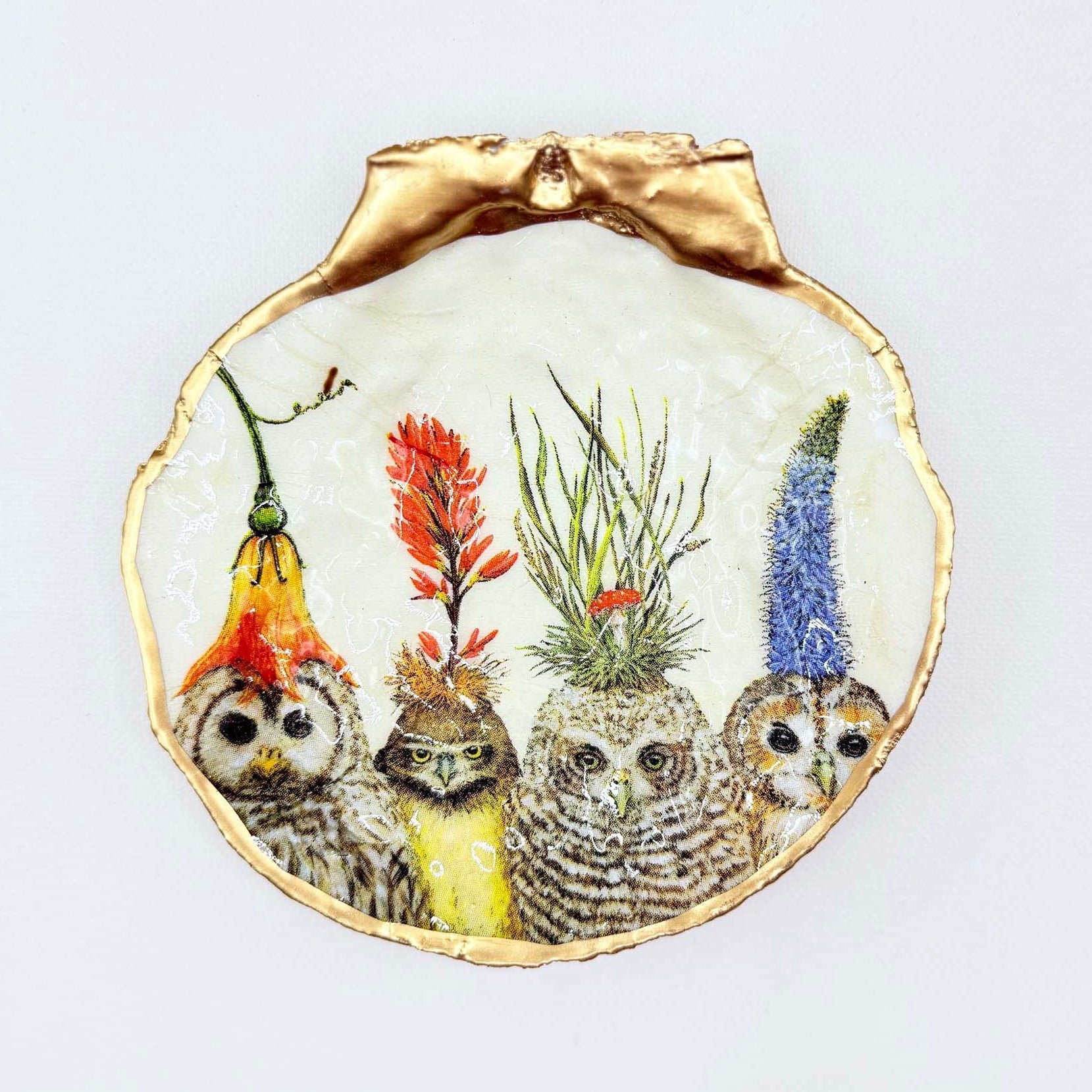 Decorative plate with painted owls and colorful plants on a white background