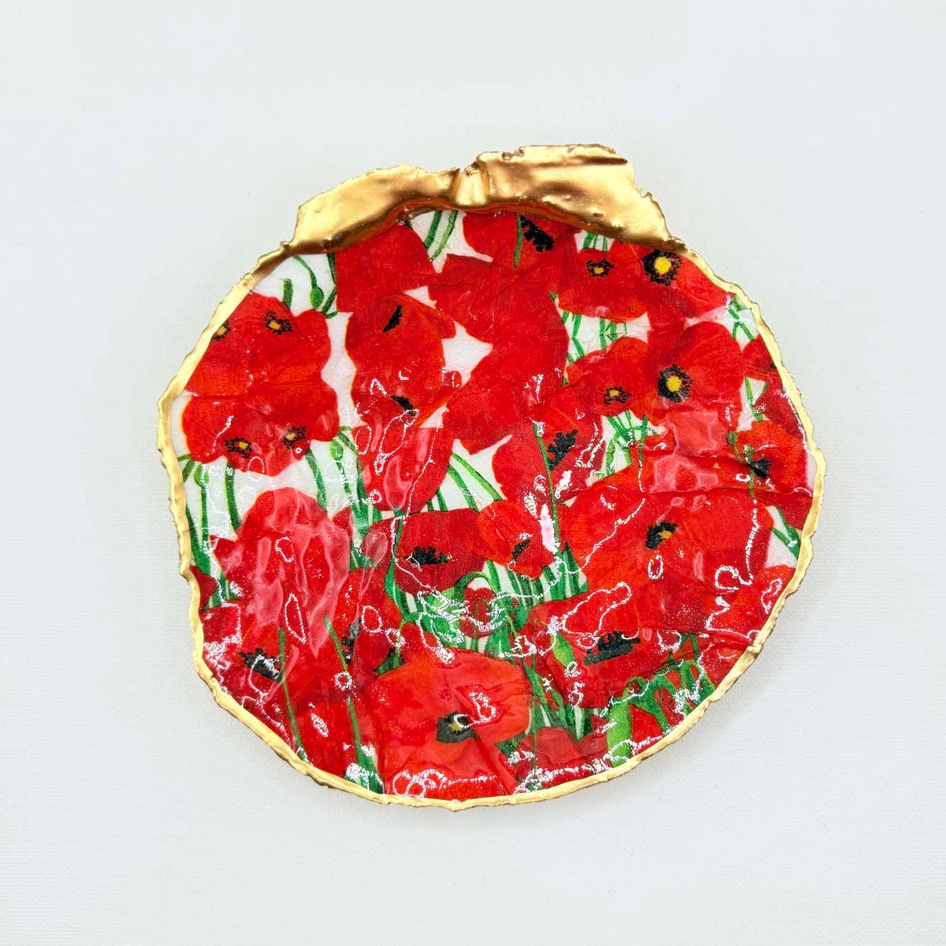 Decorative plate with red poppies floral pattern on a white card