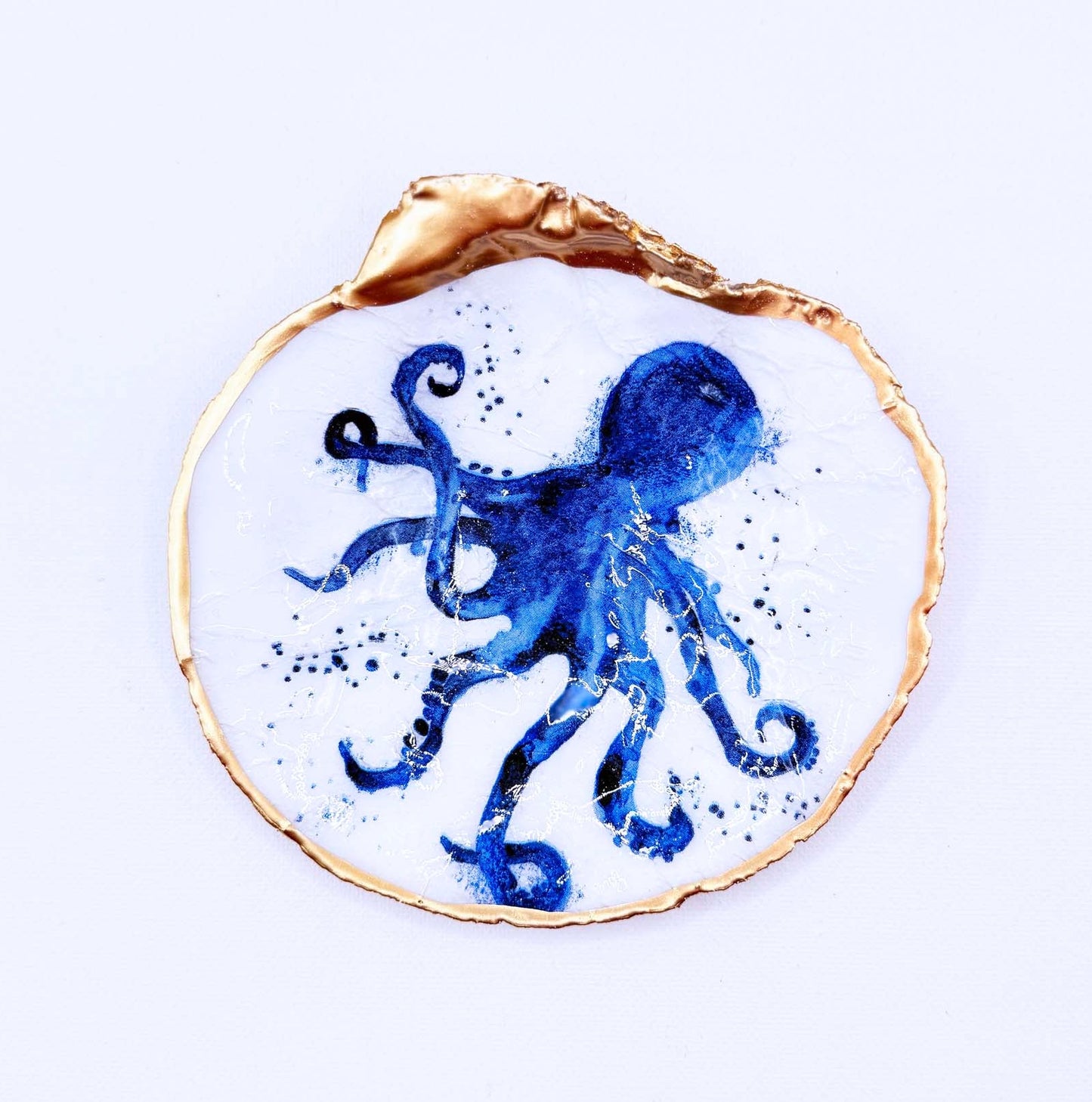 Decorative plate with a blue octopus design on a white background
