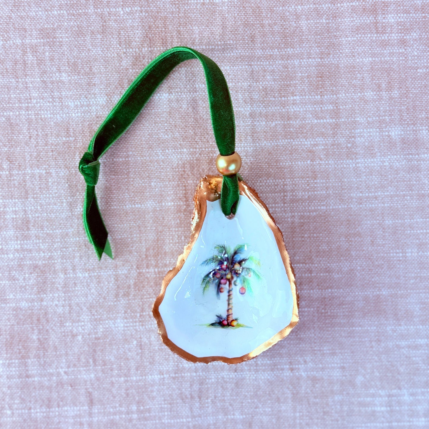 Decorative ornament with palm tree design on a beige background